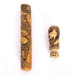 A Japanese bone pipe case, Meiji period, carved with two figures,