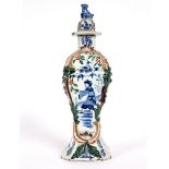 A Dutch Delft polychrome vase, circa 1780, painted a Chinaman,