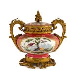 An ormolu-mounted Coalport pink ground pot pourri urn and cover, circa 1830,