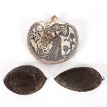 Two profusely carved coconut shell halves, and a shell carved with St Francis and the Christ Child,