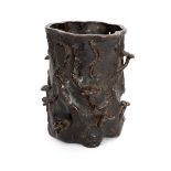 A Japanese bronze spill vase, 19th Century, Edo period, in the form of a hollow tree trunk,