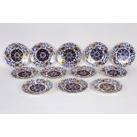 A set of twelve English porcelain plates painted in blue and gilt with a Chinese style design,