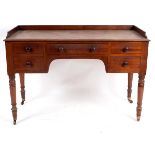 A Victorian mahogany washstand, circa 1850, with a moulded top over an arrangement of five drawers,