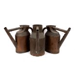 Three copper watering cans,