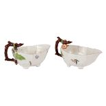 A pair of Chelsea strawberry leaf moulded sauce boats, circa 1752, the crabstock handles in brown,