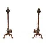 A pair of 18th Century brass mounted and cast iron fire dogs,