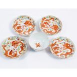 Four Chinese saucers decorated with iron red dragons 13.