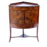 A George III mahogany bow-fronted corner washstand, circa 1790,