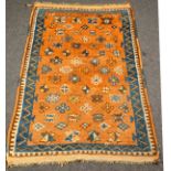 A Moroccan rug, modern copper red gul field,