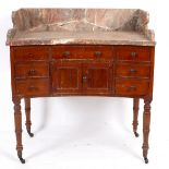 A Victorian fiddle back mahogany washstand with marble top and concave front, on turned legs,