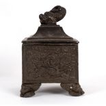 An early 19th Century square lead tobacco box embossed with hunting scenes,