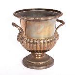 A lobed Sheffield plate wine cooler, urn shaped, the handles issuing from grotesque masks,