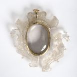 A carved rock crystal frame, possibly for a reliquary, 13cm x 9.