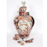 A Japanese Imari jar and cover, circa 1700, decorated with panels of birds and flowers,