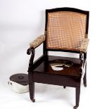A Carter 19th Century mahogany patent invalid's armchair, late 19th century, with a caned back,