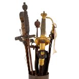 A gilt metal High Sheriff's sword, monogrammed VR, a broad sword and two other swords,