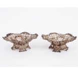 A pair of Victorian silver bon-bon dishes, London 1890/91, pierced shaped, on similar bases,