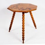 A Victorian pine octagonal tripod table, the top with painted foliage on ball turned splayed legs,