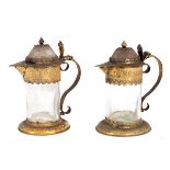 A pair of Continental travelling altar cruets, circa 1630, glass with silver-gilt mounts, 9.