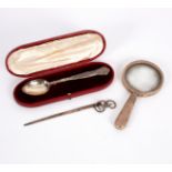A silver magnifying glass, Chester 1926, a child's spoon, Birmingham, 1833,