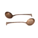 A pair of Onslow pattern silver sauce ladles, London 1737, with fluted bowls,