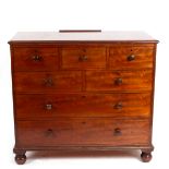 A William IV mahogany chest of five short over two long drawers, on bun feet,