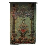 A patinated leather applied wall hanging, depicting fruit and foliage to a green ground (restored),