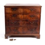 A George III mahogany chest of four long graduated drawers, on bracket feet (one foot missing), 113.