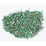 Approximately 975gm of tumbled rough emeralds/Note: This lot is subject to VAT on the hammer price