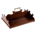 A 19th Century rosewood book trough with central brass carry handle, fret carved ends, 45.