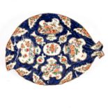 A Worcester blue scale ground leaf-shaped dish painted rich Kakiemon flowers, circa 1770,