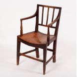 An early 19th Century oak rail back open armchair with solid seat on tapering front legs