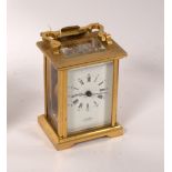 A gilt brass cased carriage clock, the white enamel dial signed JW Benson, London,