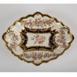 A Derby lozenge dish with floral swags and rich gilding,