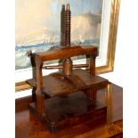 A mid 19th Century mahogany napkin press with turned screw, 30.
