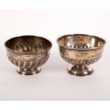A silver rose bowl, Walker & Hall, Sheffield, date letter rubbed and a similar rose bowl,