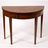 An 18th Century satinwood card table, the top inlaid a foliate decorated band,