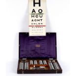 An Optometrist's vision trial set in a wooden case by Theodore Hamblin Ltd.