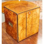 A burr walnut humidor fitted three drawers with countersunk handles, enclosed by a pair of doors,