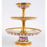 A French porcelain three-tier cake stand, mid 19th Century,