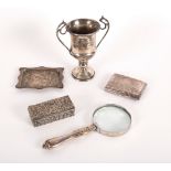 A silver twin-handled trophy cup, 14cm high, an engraved cigarette case, a rectangular trinket box,
