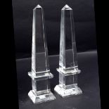 A pair of glass obelisks,