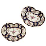 A pair of Worcester blue scale ground kidney-shaped dishes, circa 1770, with floral panels,