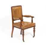 An armchair attributed to Lamb of Manchester with button upholstered leather seat and studding to