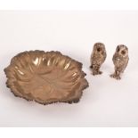 A novelty silver salt and pepper pot of owl form, PJM, Birmingham 2011, each with glass eyes, 5.