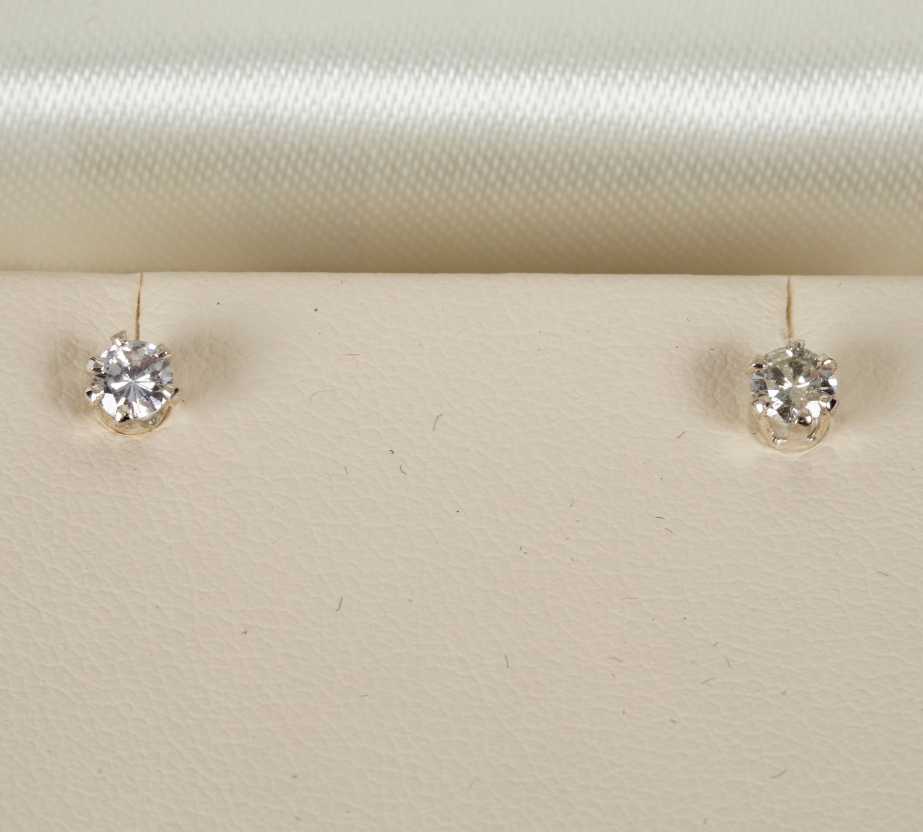 A pair of diamond ear studs, each stone approximately 0.