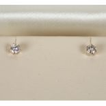 A pair of diamond ear studs, each stone approximately 0.