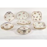 Eleven Sèvres dessert dishes and an oval sugar bowl and cover with integral stand,