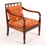 A Regency open armchair with cane seat,