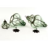 A pair of Venetian glass ceiling lanterns, of globular green glass form,